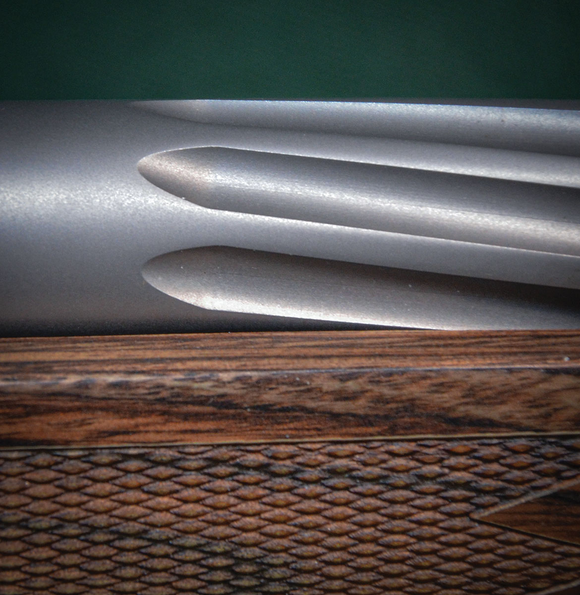Exterior stainless-steel barrel treatment options are helical fluting (shown here), straight fluting or no fluting. Blackening the surfaces of the flutes while leaving the rest of the barrel in the white is another option.